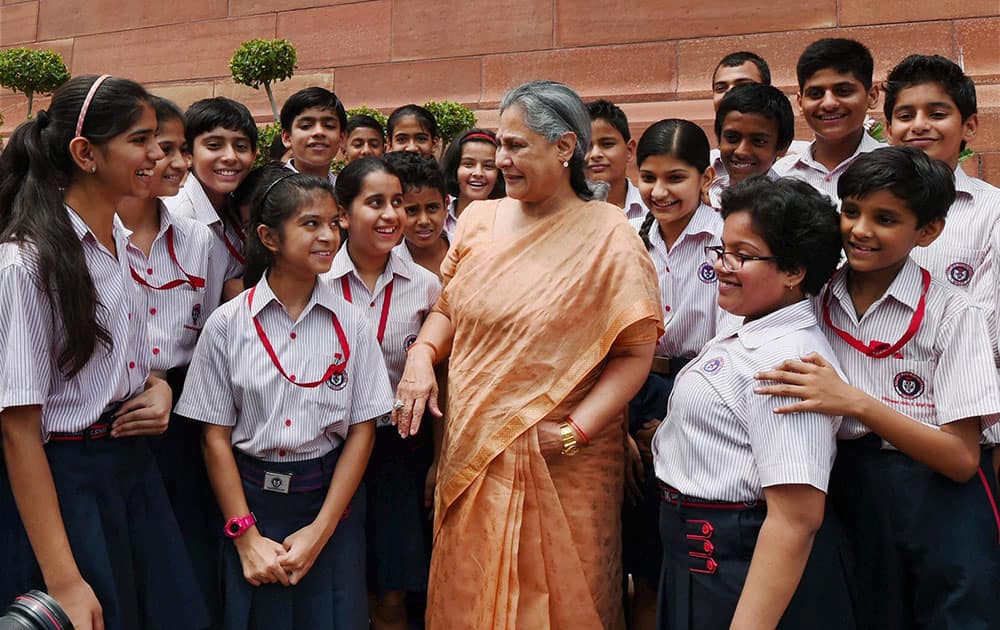 Rajya Sabha MP Jaya Bachchan with school children during the ongoing Monsoon session at Parliament in New Delhi.