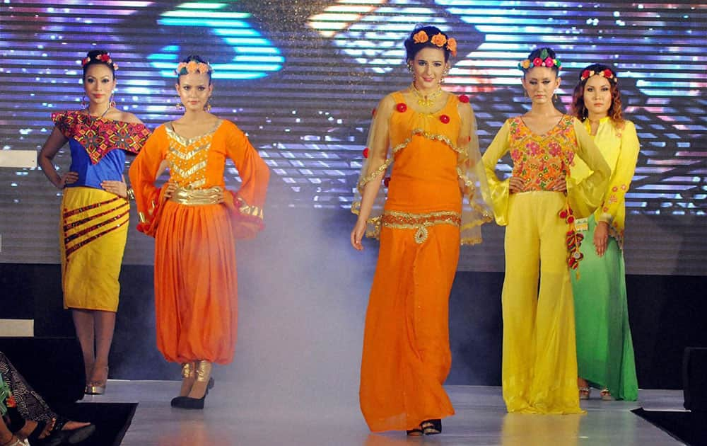 Models walk the ramp at a fashion show in Dibrugarh.