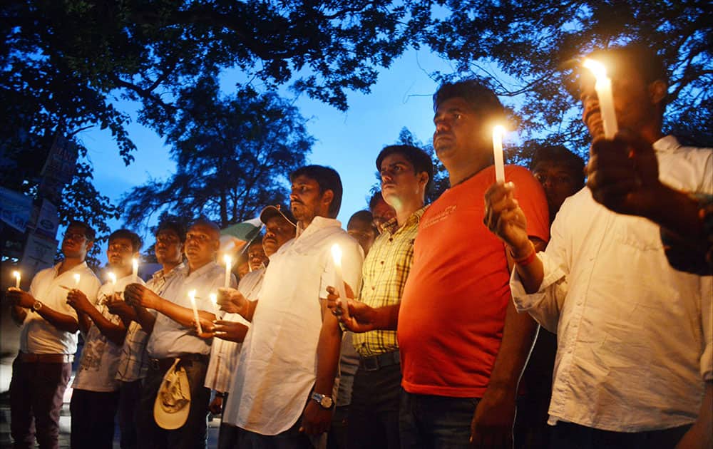 People light candles to pay tribute to Baijnath Dham stampede victims in Deoghar.