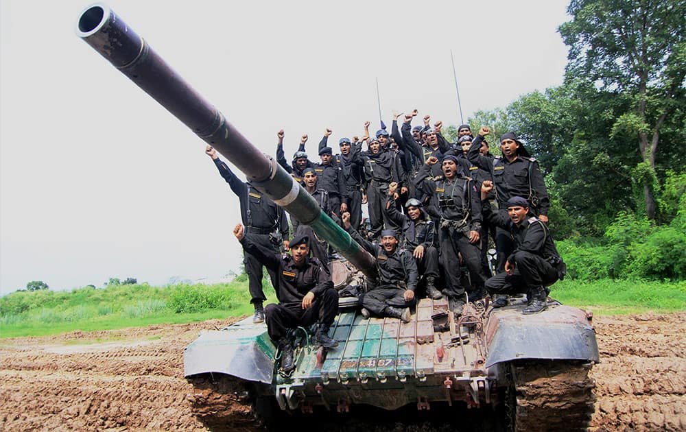 Army personnel raising slogans near the T72 Tank during an event to mark the victory of 1965 Indo-Pak war in Jammu.