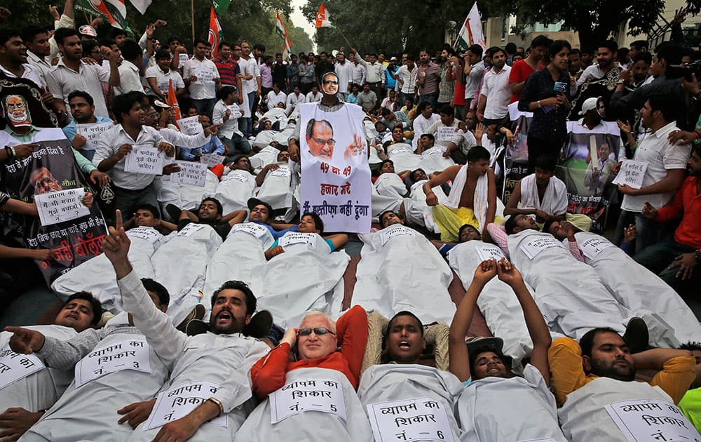 India’s opposition Congress party’s youth wing activists shout slogans demanding the resignation of three key ruling party leaders accused of abusing their authority and financial irregularities during a protest near the Indian Parliament in New Delhi, India.