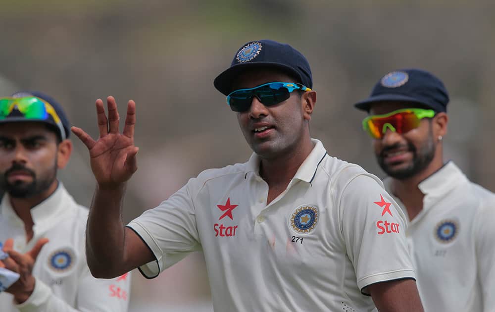 Ravichandran Ashwin acknowledges after taking five Sri Lankan wickets during the first cricket test match between India and Sri Lanka in Galle.
