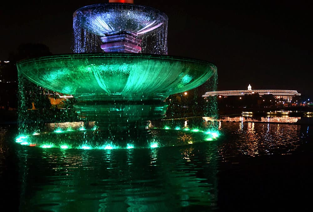 A decorated fountain near the illuminated Parliament house in preparations for Independence day celebrationsin New Delhi.