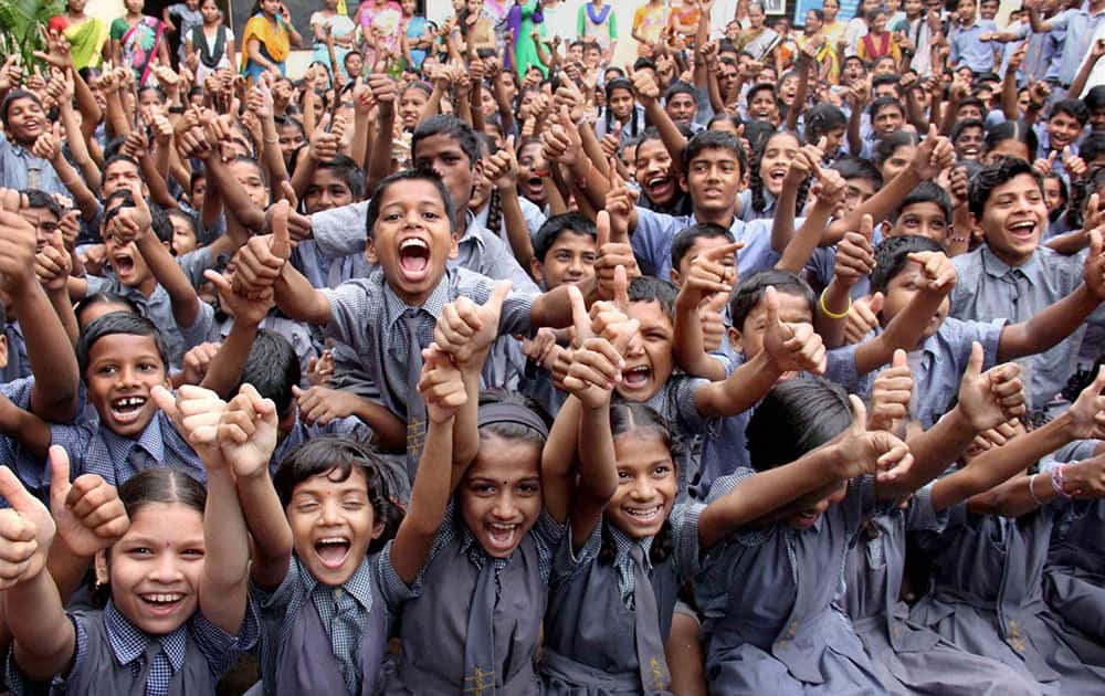 Children celebrate after saving their school from demolition at Chandivali Andheri East in Mumbai.