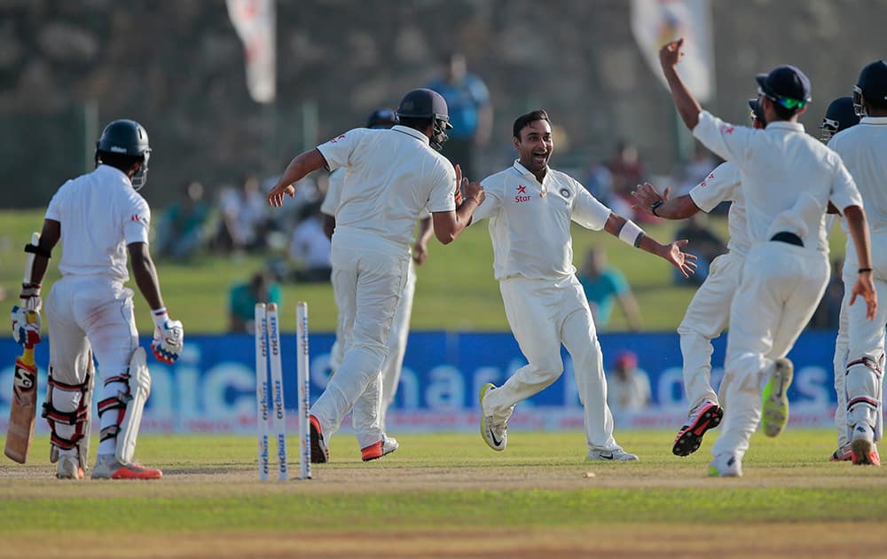 Amit Misra celebrates the wicket of Sri Lankan batsman Kaushal Silva during the second day of the first test cricket match between Sri Lanka and India in Galle, Sri Lanka.
