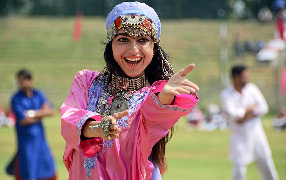 A College girl performs during the full dress rehearsal for Independence Day at Bakhshi Stadium in Srinagar.
