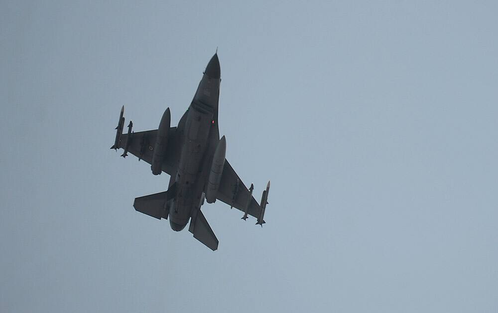 A Turkish Air Force fighter plane flies over the Incirlik Air Base, in Adana, southern Turkey.