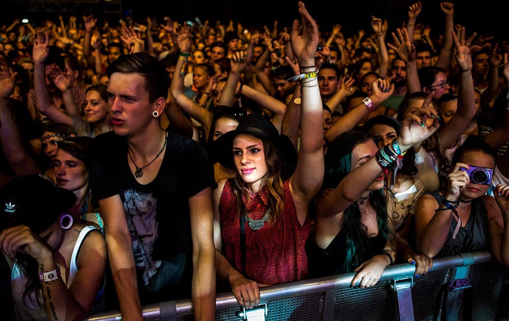 Fans gesture as British singer Ella Eyre performs, at the 23rd Sziget (Island) Festival on Shipyard Island, Northern Budapest, Hungary.