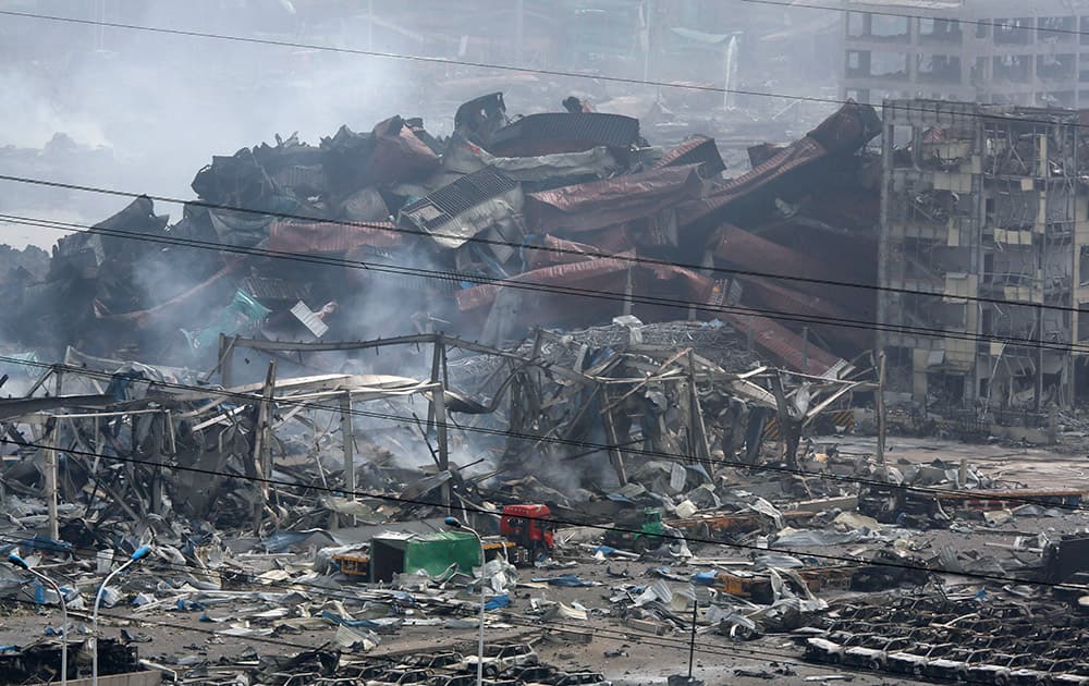 Deformed containers pile up at the site of an explosion at a warehouse in northeastern China's Tianjin municipality.