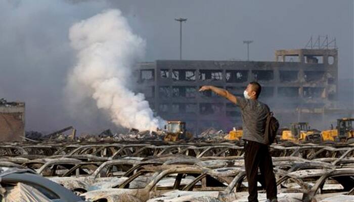 China battles fires, contamination at chemical blast site
