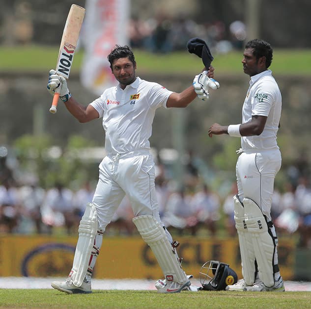 Kumar Sangakkara acknowledges the crowd after being dismissed during the third day of the first cricket test match between India and Sri Lanka in Galle, Sri Lanka.