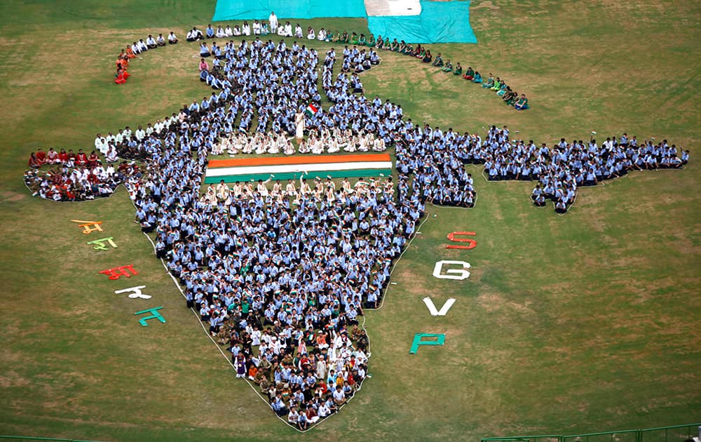 Students and teachers of Swaminarayan Gurukul form the map of India on the eve of Independence Day in Ahmadabad.