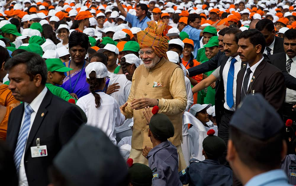 Prime Minister Narendra Modi greets Indian children after his Independence Day speech at the Red Fort in New Delhi.