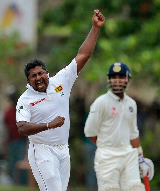 Rangana Herath celebrates the dismissal of Harbhajan Singh during the fourth day of their first test cricket match in Galle, Sri Lanka. Sri Lanka won by 63 runs.