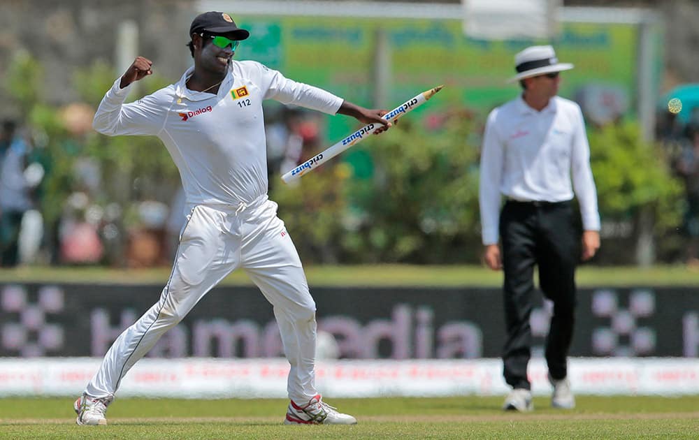 Sri Lanka's captain Angelo Mathews celebrates their victory over India during the fourth day of their first test cricket match in Galle, Sri Lanka. Sri Lanka won by 63 runs.