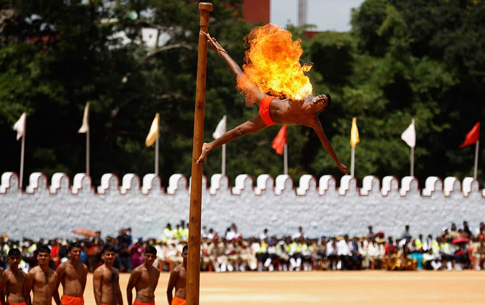 An Indian army soldier performs Malkhamb, an ancient form of Indian gymnastics, on the occasion of India’s 69th Independence Day in Bangalore.