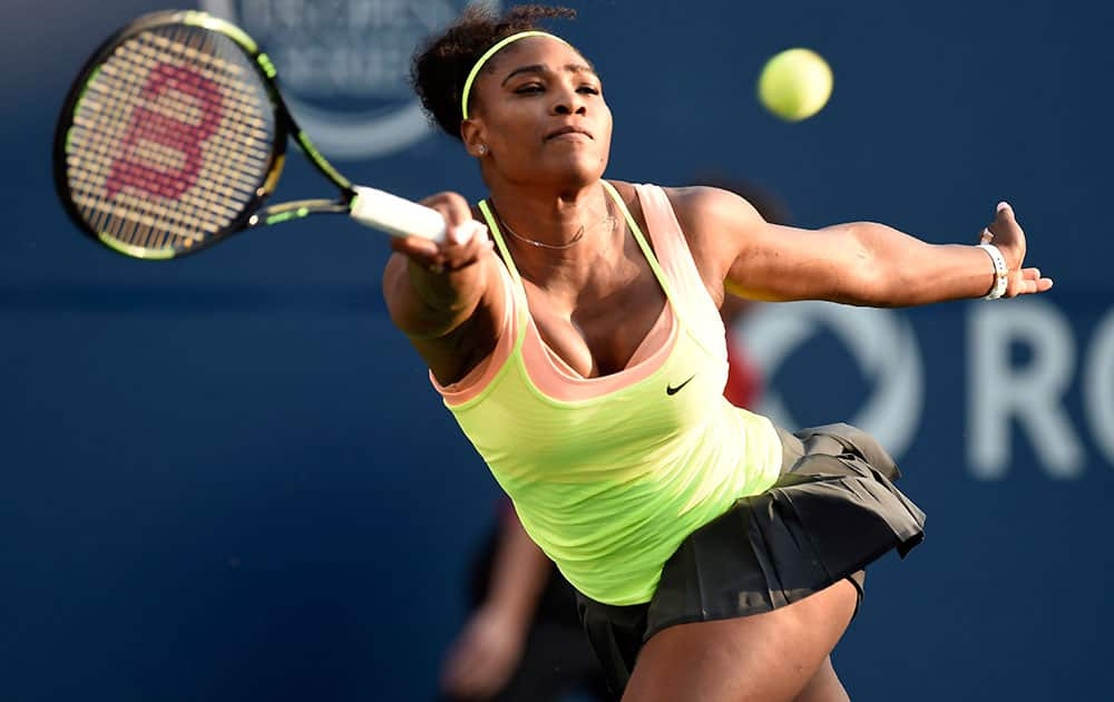 Serena Williams, of the United States, returns to Belinda Bencic, of Switzerland, during a Rogers Cup semifinal tennis match in Toronto.