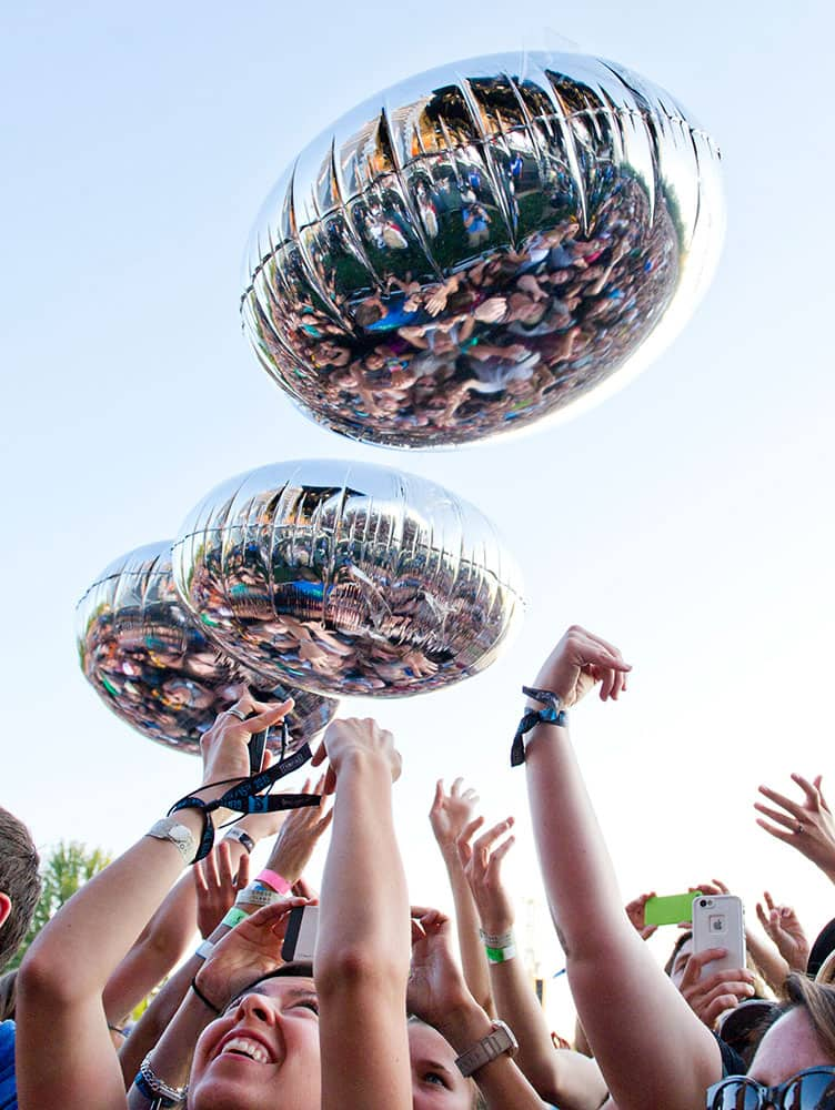 Fans bounce balloons tossed into the crowd by The Flaming Lips during their concert at the Gentlemen Of The Road Stopover festival in Walla Walla, Wash.