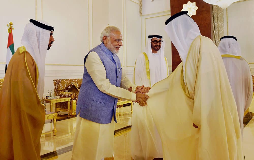 Prime Minister Narendra Modi shakes hands with Minister of Abu Dhabi on his arrival in Abu Dhabi.