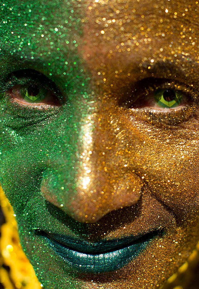 A demonstrator wearign contact lenses and with his face painted with the colors of the Brazilian flag poses for a picture during a protest demanding the impeachment of Brazil's President Dilma Rousseff in Sao Paulo, Brazil.