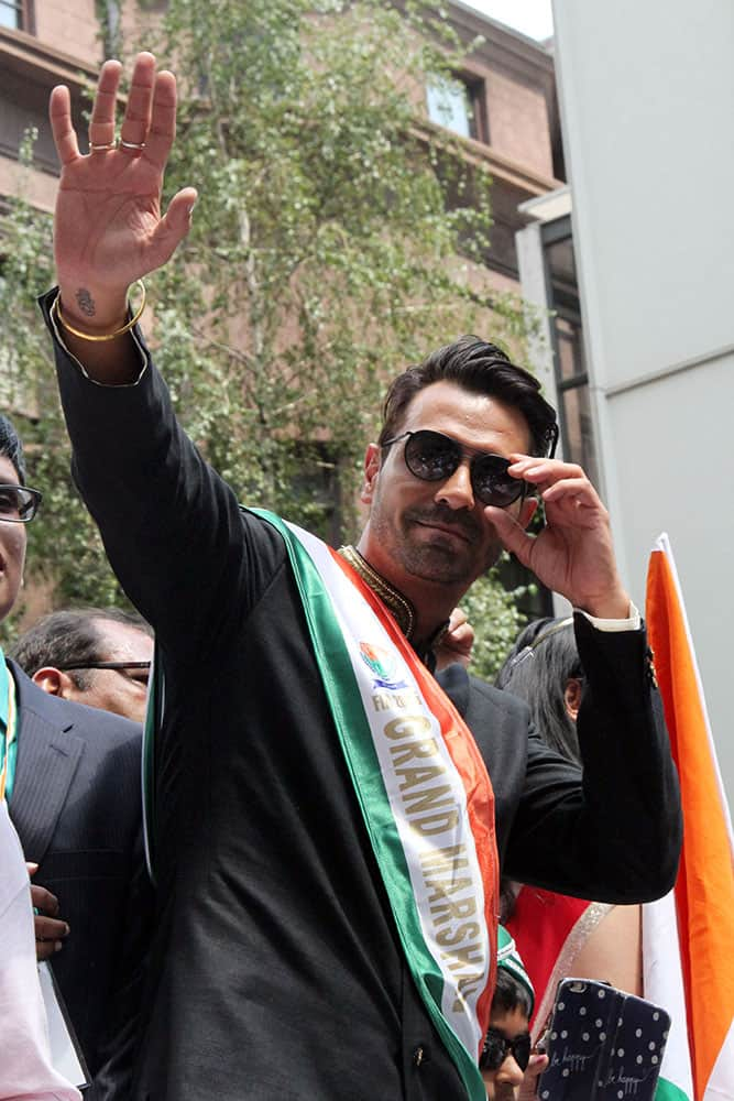 Arjun Rampal waves to the crowd as he takes part in the India Day Parade along Madison Avenue in New York. Rampal was the parade's Grand Marshal.