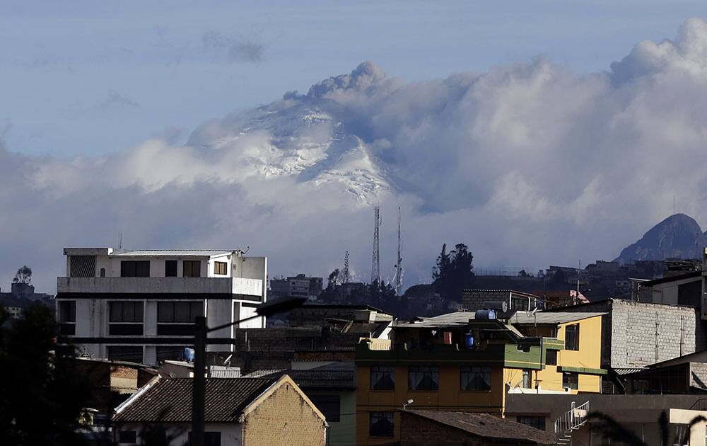 The Cotopaxi volcano spews ash and vapor near Quito, Ecuador.