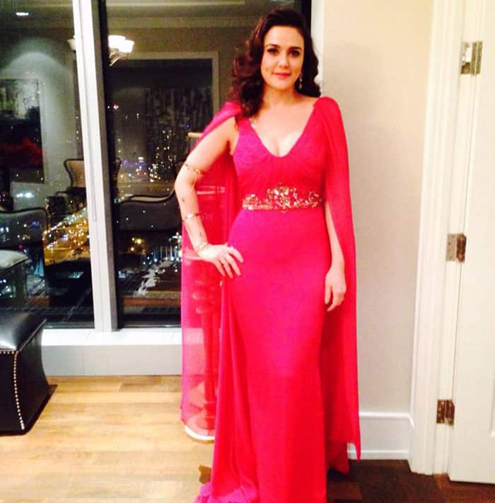 Preity zinta ‏:- Striking a pose in this hot pink dress by Marchesa in the hotel right before I left for the event. -twitter