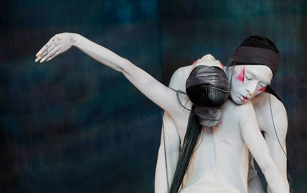 Dancers from the 'Legend Lin Dance Theatre' perform the artistic director and choreographer Li-chen LIN’s classic works 'Hymne aux Fleurs qui Passent, Anthem to the Fading Flowers' during a rehearsal at the National Theater Concert Hall in Taipei, Taiwan.