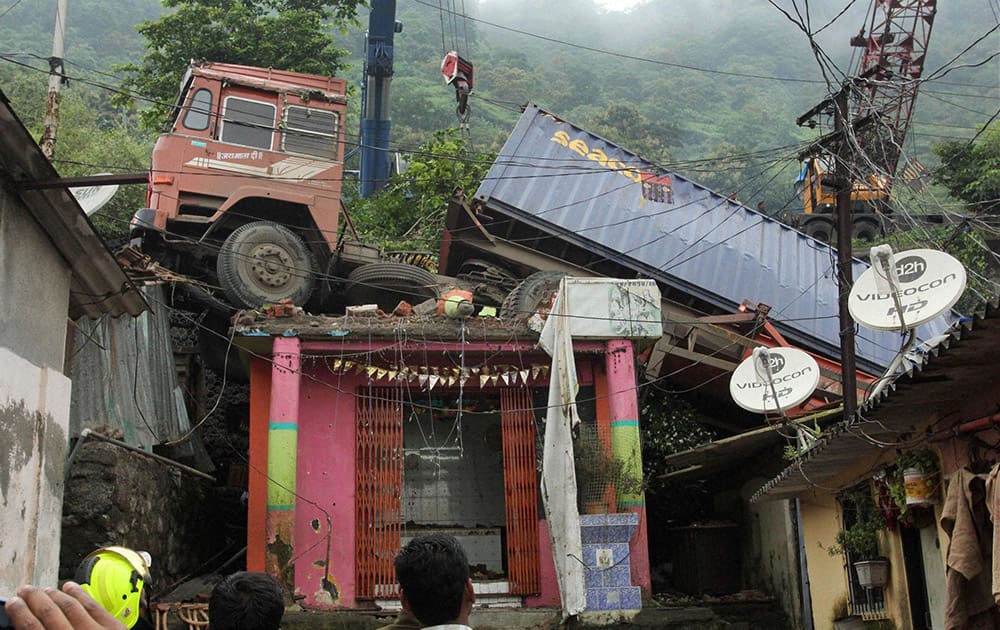 A huge container that fell over the slums at Mumbra Bypass in Thane, Mumbai during the wee hours of Tuesday.