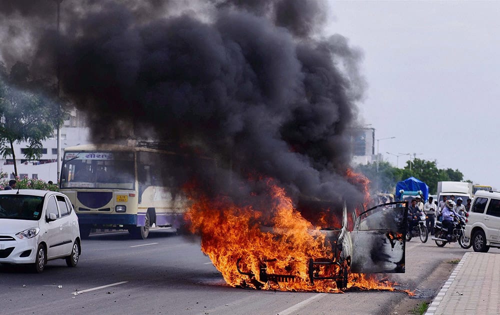 A car catches fire in Ahmedabad.