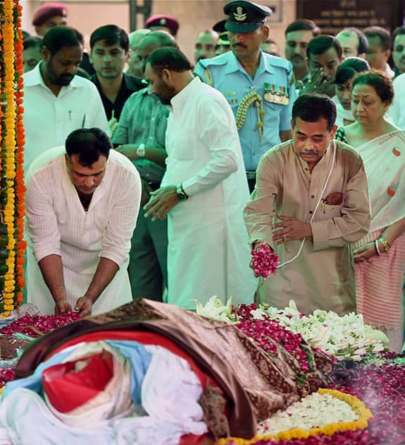 Congress leader Abhijit Mukherjee performs rituals for the last rites of his mother and First Lady, Suvra Mukherjee at Lodhi Road Crematorium in New Delhi.