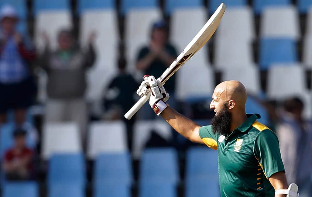 South Africa’s batsman Hashim Amla, waves his bat after reaching his century during their first One Day International cricket match against New Zealand at the Centurion Park stadium in Pretoria, South Africa.