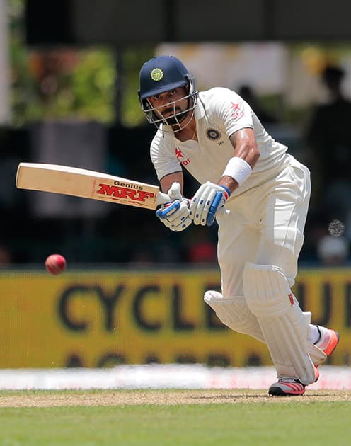 Virat Kohli plays a shot during the first day's play of the second test cricket match between Sri Lanka and India in Colombo, Sri Lanka.