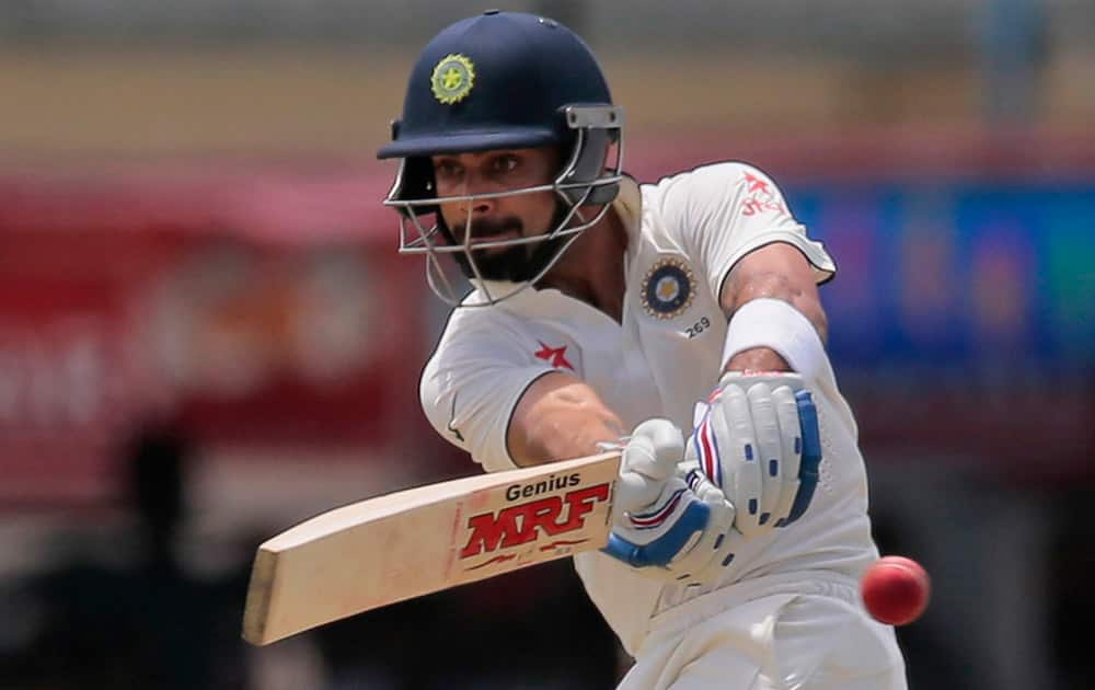 Virat Kohli plays a shot during the first day's play of the second test cricket match between Sri Lanka and India in Colombo, Sri Lanka.