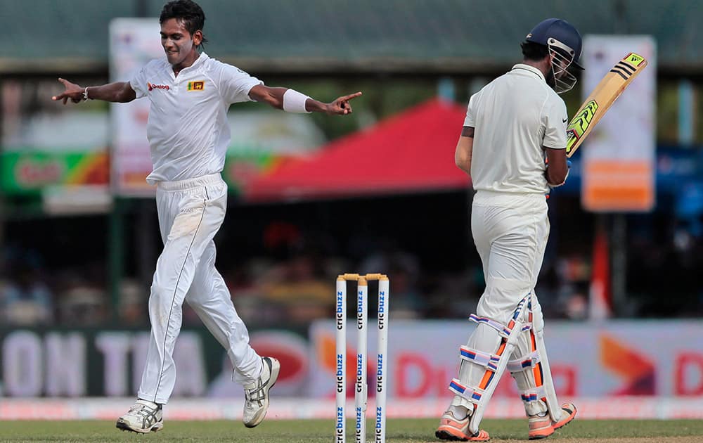 Sri Lanka's Dushmantha Chameera celebrates the dismissal of India's Lokesh Rahul during the first day's play of their second test cricket match in Colombo, Sri Lanka.