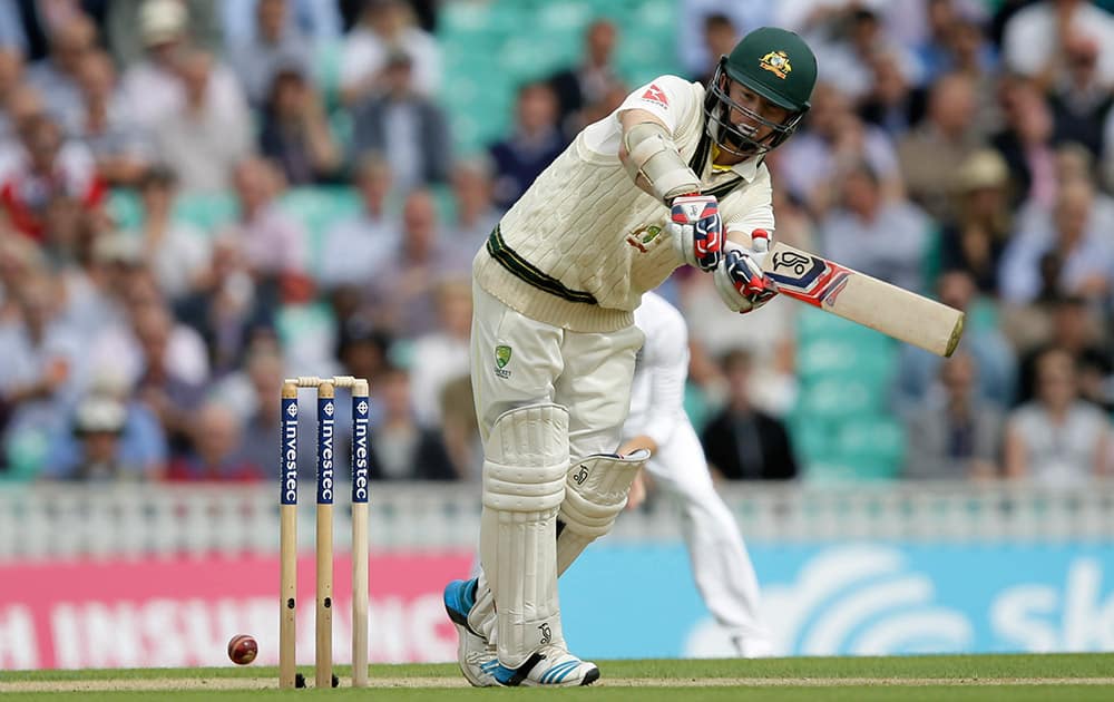 Australia's Chris Rogers plays a shot off the bowling of England's Stuart Broad on the first day of the fifth Ashes Test match between England and Australia, at the Oval cricket ground in London.