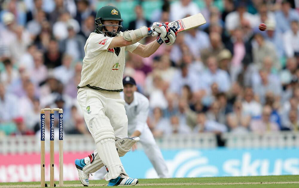 Australia's Chris Rogers plays a shot off the bowling of England's Stuart Broad on the first day of the fifth Ashes Test match between England and Australia, at the Oval cricket ground in London.