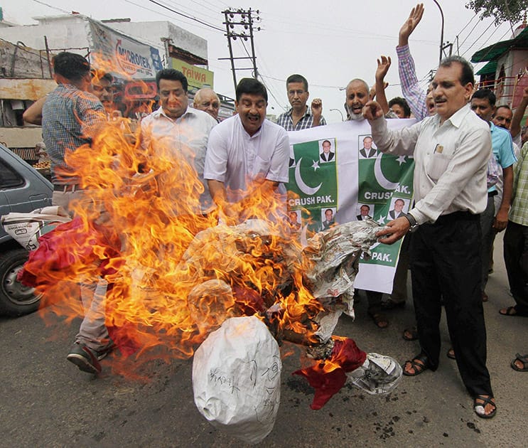 Activists of Jammu West Assembly Movement burn effigies during a protest against Pakistan in Jammu.