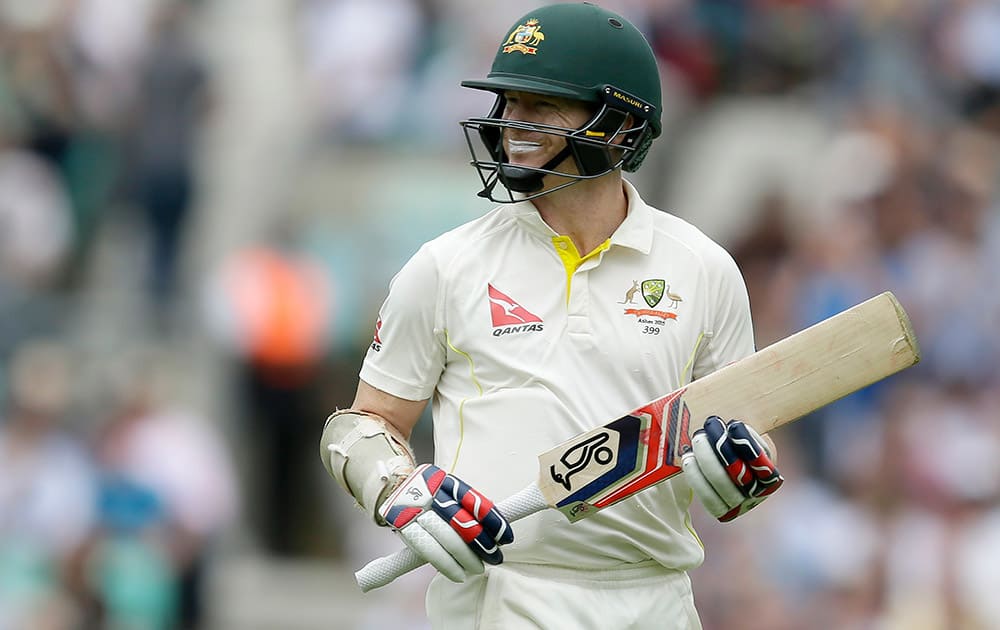 Chris Rogers leaves the field after losing his wicket to England's Mark Wood on the first day of the fifth Ashes Test match between England and Australia, at the Oval cricket ground in London.