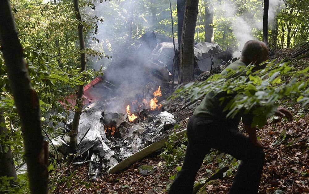 The burning debries of a light aircraft photographed near the village of Cerveny Kamen, Slovakia.