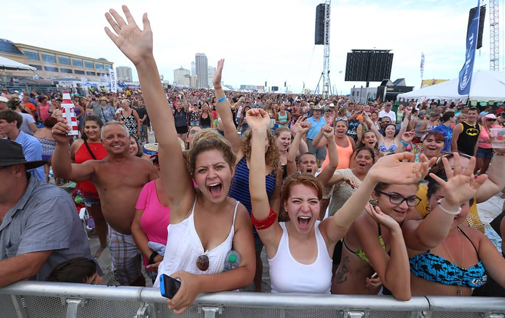 Fans cheer as Rascal Flatts performs during a beach concert in Atlantic City, NJ.