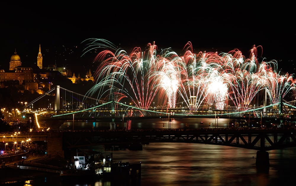 Fireworks explode above the River Danube as part of celebrations of the national holiday in central Budapest, Hungary.