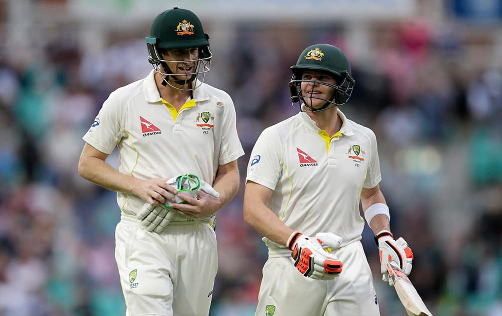 Australia's Adam Voges and Steven Smith leave the field at the end of play on the first day of the fifth Ashes Test match between England and Australia, at the Oval cricket ground in London.