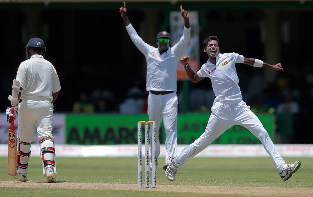 Sri Lanka's Dushmantha Chameera celebrates the dismissal of India's Amit Mishra during the second day's play play of their second test cricket match in Colombo, Sri Lanka.