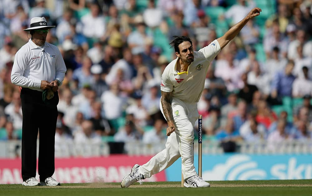 Australia’s Mitchell Johnson bowls the England’s Alastair Cook on the second day of the fifth Ashes Test match between England and Australia, at the Oval cricket ground in London.