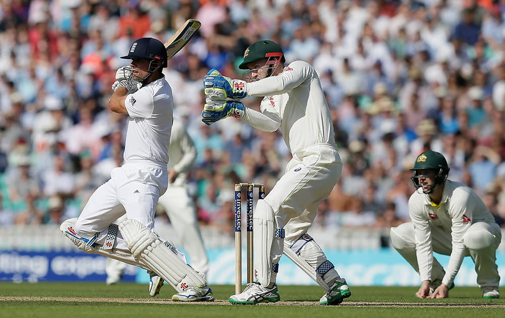 England’s Alastair Cook plays a shot off the bowling of Australia’s Nathan Lyon on the second day of the fifth Ashes Test match between England and Australia, at the Oval cricket ground in London.