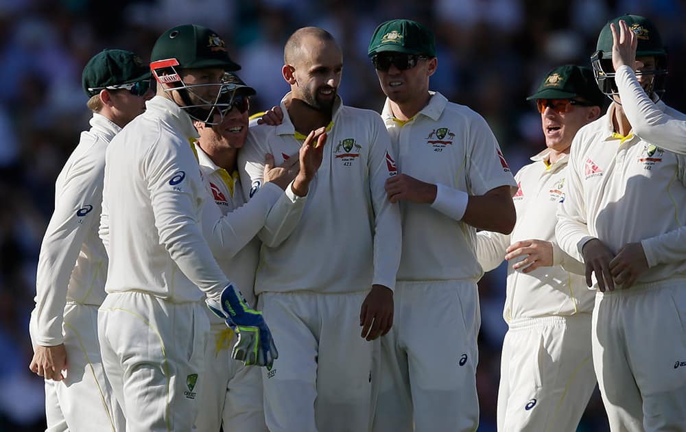 Australia’s Nathan Lyon, centre, celebrates with his teammates after taking the wicket of England’s Jos Buttler on the second day of the fifth Ashes Test match between England and Australia, at the Oval cricket ground in London.