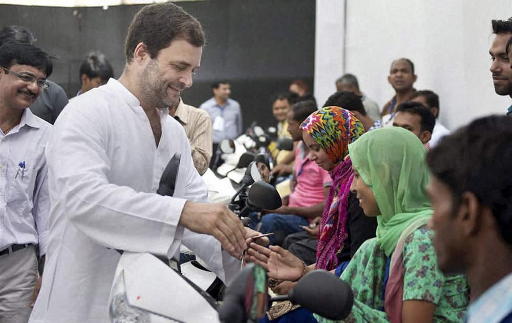 Congress Vice President Rahul Gandhi distributing scooters to physically challenged persons at Jawahar Bhawan in New Delhi.