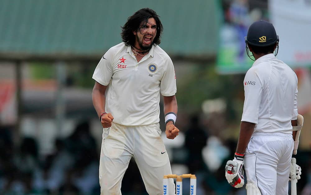 Ishant Sharma, celebrates the dismissal of Sri Lanka's Lahiru Thirimanne during the third day's play of the second test cricket match between them in Colombo.