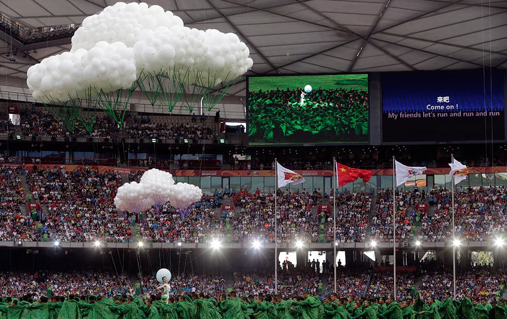 Performers dance during the opening ceremony of the World Athletics Championships at the Bird's Nest stadium in Beijing